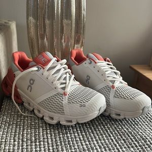 On Cloud Cloudtec Helion. White, coral heel, and grey accents.